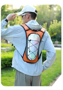 Detailed view of lightweight hydration vest with reflective panel and orange trim for trail running