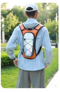 Lightweight orange and iridescent reflective hydration backpack for running and cycling.