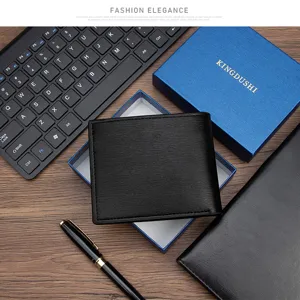 Macro detail of high-quality black PU leather men's wallet presented on blue gift box.