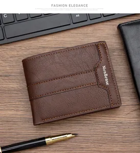 Detail of brown vintage leather men's bifold wallet with contrast stitching and logo