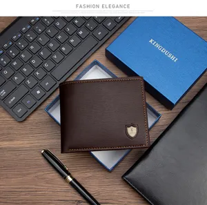 Close-up detail of a dark brown men's PU leather wallet in a blue gift box set