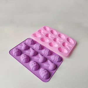 Set of two Easter silicone baking molds featuring bunny faces and decorated egg patterns