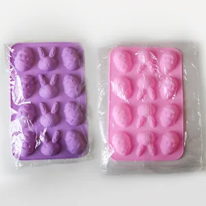 Set of Easter bunny and egg shaped silicone baking molds in purple and pink colors