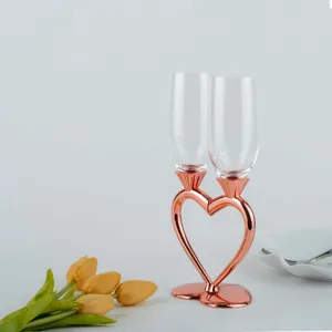 Romantic heart-shaped crystal champagne flute set with rose gold metal base for wedding