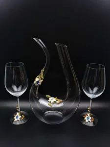 Crystal glass decanter set with elegant enamel flower decor, perfect for wine tasting details.
