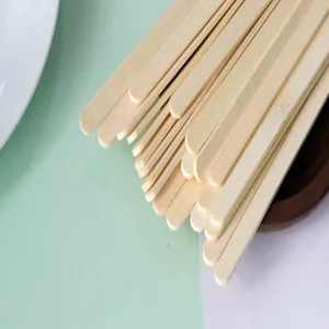 Close-up detail of smooth natural bamboo popsicle sticks for DIY crafts and food use
