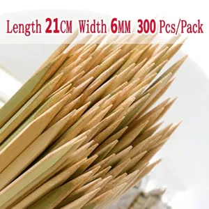 Detailed close-up view of disposable flat bamboo BBQ skewers, 21cm length, pack of 300 pcs