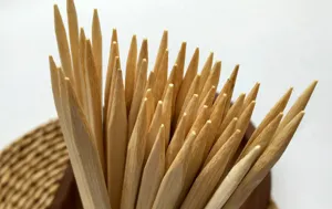 Close-up of sharp tips on 21cm flat bamboo skewers for Japanese yakitori BBQ