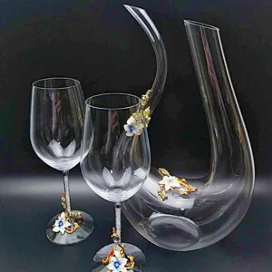 Crystal wine glass and decanter set with elegant enamel flowers and gold rhinestone accents.