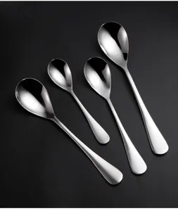 Set of 4 stainless steel oval spoons with polished mirror finish on black background