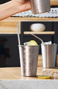 Detailed macro shot of 304 stainless steel cold drink cups with ice and fresh lemon slices