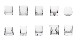 Collection of crystal whiskey glasses in various textures and thick-base designs