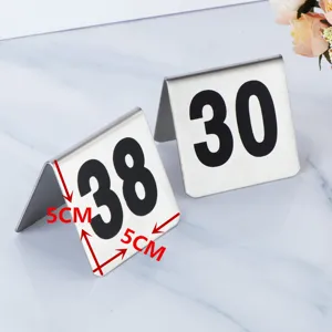 Stainless steel table number sign, double sided black digits 38 and 30 for restaurant use