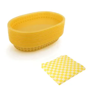 Lot de paniers de restauration rapide ovales en plastique jaune avec papier quadrillé.