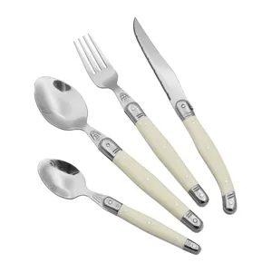 Laguiole style cutlery set with ivory white handles and signature bee engraving