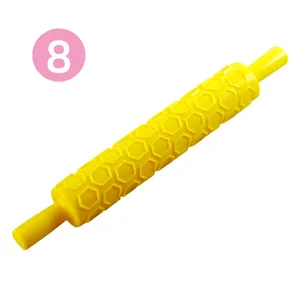 Gele plastic deegroller met reliëf en honingraatpatroon voor DIY bakken van cake