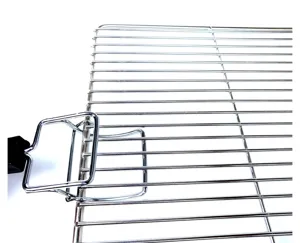 Close-up view of chrome-plated pan lifter tool gripping a wire oven grill rack detail