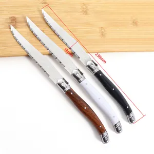 Stainless steel steak knife set with laser pattern, serrated blade, and multi-color handles.