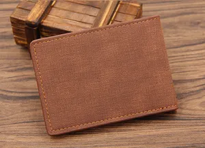 Close-up of professional brown textured business driver's license cover on wooden surface