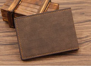 Close-up of brown textured driver's license cover with orange stitching details