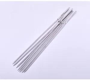 Detail shot of heavy-duty stainless steel flat barbecue skewers for outdoor grilling