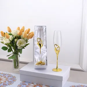 Elegant gold heart wedding champagne flutes with crystal rhinestone accents