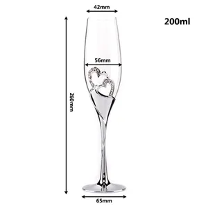 Elegant heart-shaped champagne flute with rhinestones, silver stem and 200ml capacity