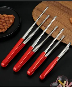 Detailed view of stainless steel food tongs with red handles for BBQ and steak.