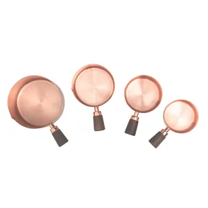 Set of 4 rose gold stainless steel measuring cups with walnut wood handles for kitchen use