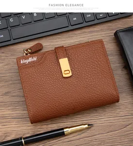 Detail view of brown lychee pattern leather wallet with golden buckle and zipper