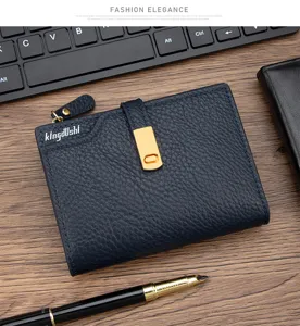 Close-up of navy blue litchi grain women's short wallet with gold clasp