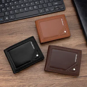 Set of stylish embossed men's bifold wallets in black and brown on wooden desktop