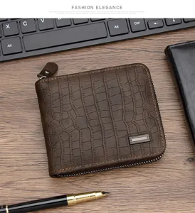 Textura detallada de cartera marrón para hombre con patrón de cocodrilo
