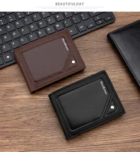 Close-up detail of brown and black embossed leather bifold wallets for men on a wooden desk
