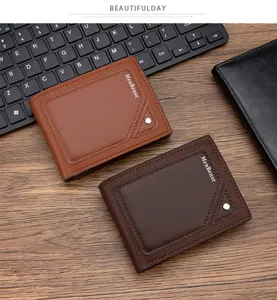 Men's slim embossed bifold wallets in brown and coffee leather on a wooden desk