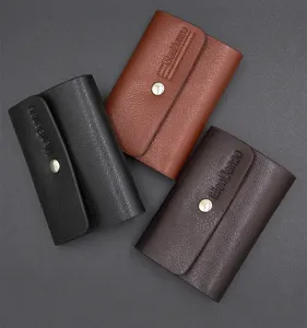Three stylish textured leather card holders in black, brown, and dark brown finishes.