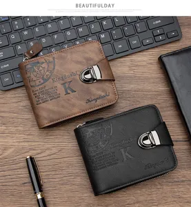Top-down view of classic brown and black men's wallets with metal clasp on wooden desk