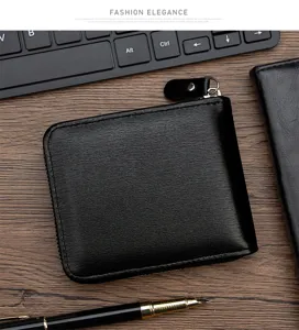 Detail view of a black men's short wallet with brushed leather texture and zipper closure