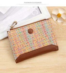 Close-up of vibrant colorful woven leather coin purse with zipper and snap button closure