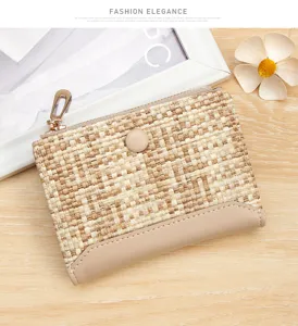 Close-up of stylish woven texture women's small wallet with zip and snap closure