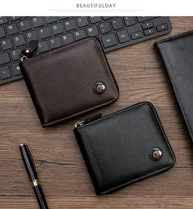 Detailed view of brushed leather men's zip-around wallets with metal logo accent