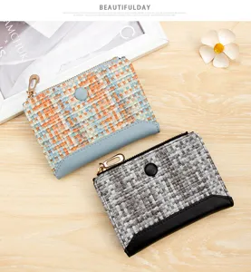Detail of colorful woven leather wallets for women with zipper and snap button