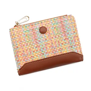 Colorful woven leather short wallet for women featuring a secure zipper and snap closure