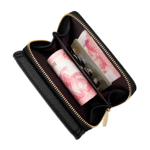 Elegante billetera corta para mujer con cremallera y patrón de lichi en cuero negro