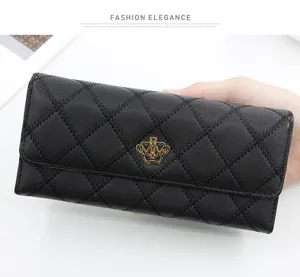 Close-up detail of black quilted leather long wallet featuring elegant gold crown logo