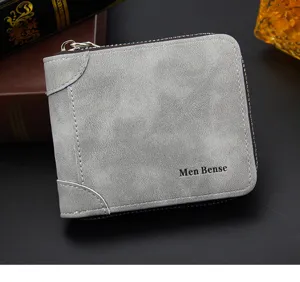 Détail rapproché du portefeuille gris MenBense avec fermeture éclair et cuir vintage