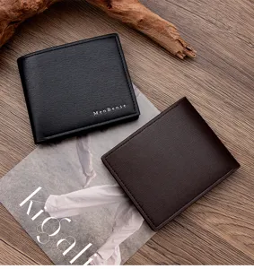 Close-up detail of premium brushed texture on men's leather wallets in black and brown