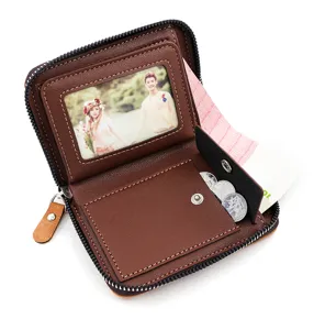 Detail view of brown matte faux leather men's zip wallet showing interior storage slots