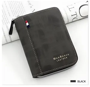 Detail of a men's dark gray zip-around wallet with frosted leather and gold MenBense logo.