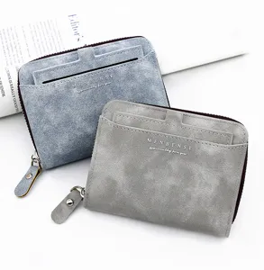 Close-up of frosted leather men's short wallets with multiple card slots and zippers.